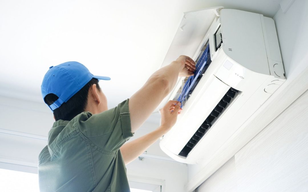 HVAC technician servicing a ductless mini split in Duarte