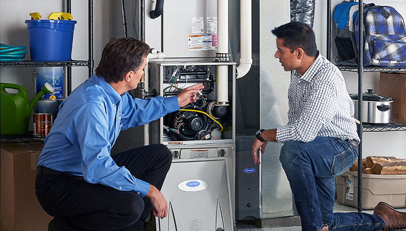 Technician evaluating a furnace for repair or replacement in Duarte