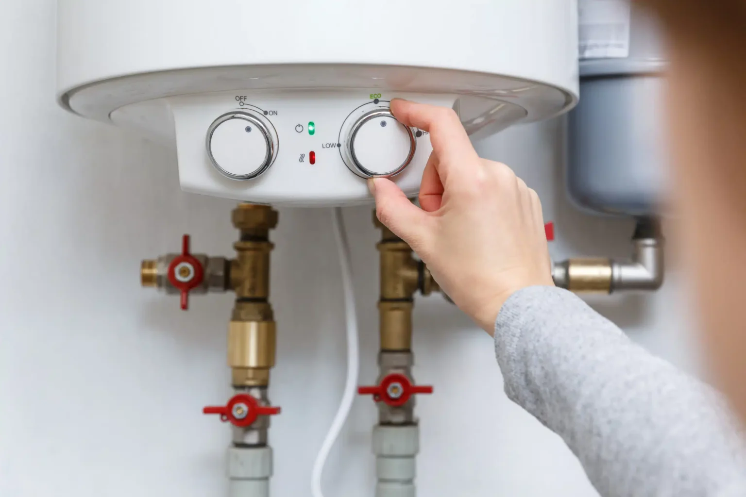 Technician adjusting a water heater in Duarte